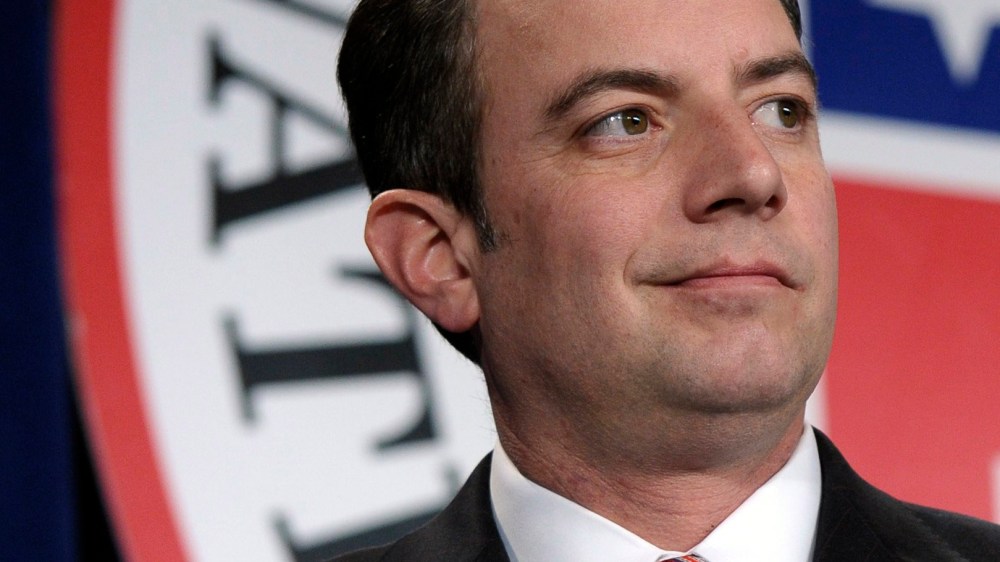 This Jan. 24, 2014 file photo shows Republican National Committee (RNC) Chairman Reince Priebus standing on stage at the Republican National Committee winter meeting in Washington.