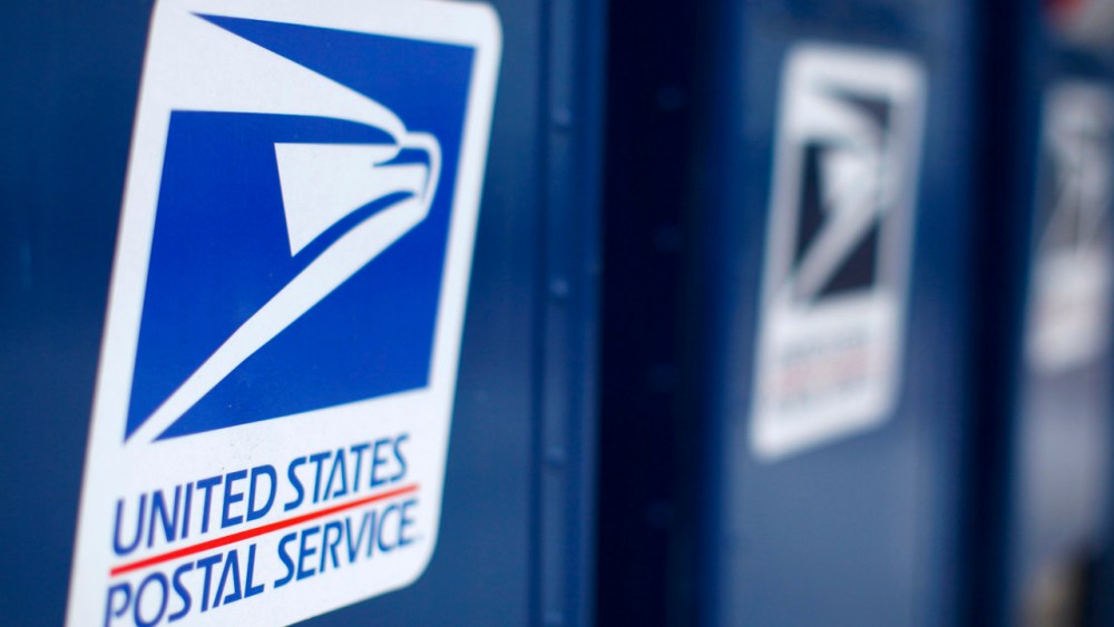 The Postal Service wants to drop Saturday delivery of first-class mail by August in its latest effort to cut costs after losing nearly $16 billion last fiscal year. (REUTERS/Mike Blake)