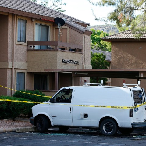 Police tape surrounds a vehicle searched by authorities, on May 4, 2015, in Phoenix, believed to belong to one of two gunmen who were shot and killed the night before outside a venue hosting an exhibit about the Prophet Muhammad in suburban Dallas.