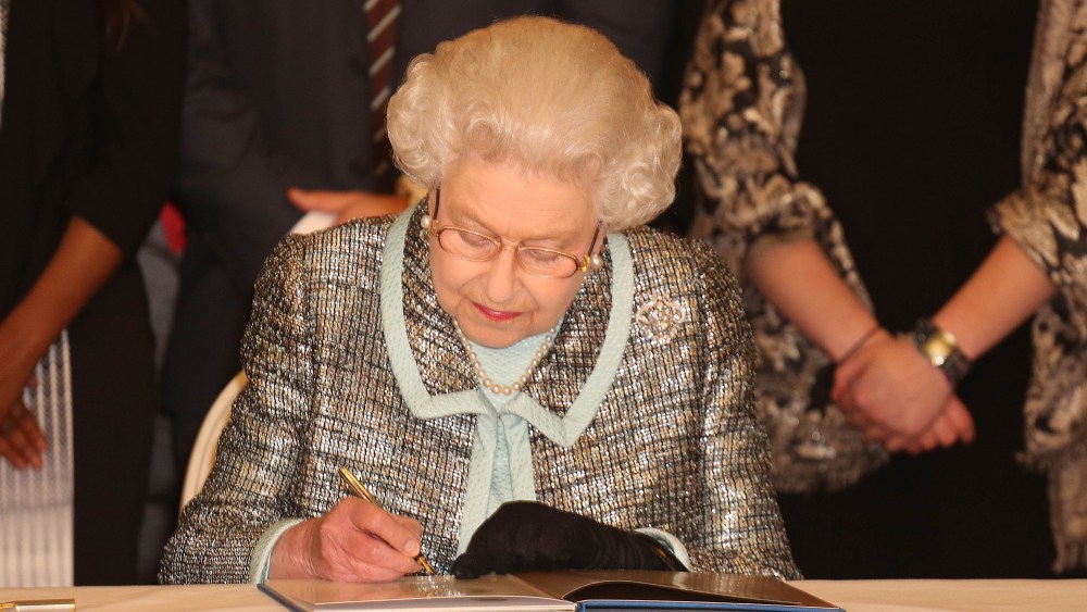 Commonwealth Day. Queen Elizabeth II, Head of the Commonwealth signs the Commonwealth Charter at a reception at Marlborough House, London. Picture date: Monday March 11, 2013. The Charter is an historic document which brings together, for the first...