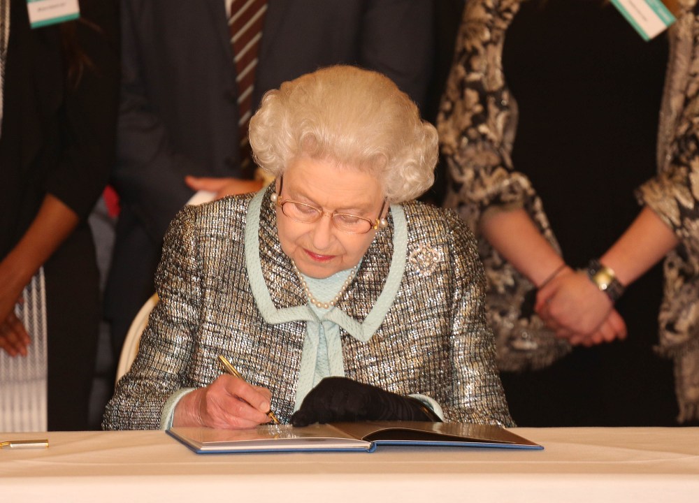 Commonwealth Day. Queen Elizabeth II, Head of the Commonwealth signs the Commonwealth Charter at a reception at Marlborough House, London. Picture date: Monday March 11, 2013. The Charter is an historic document which brings together, for the first...