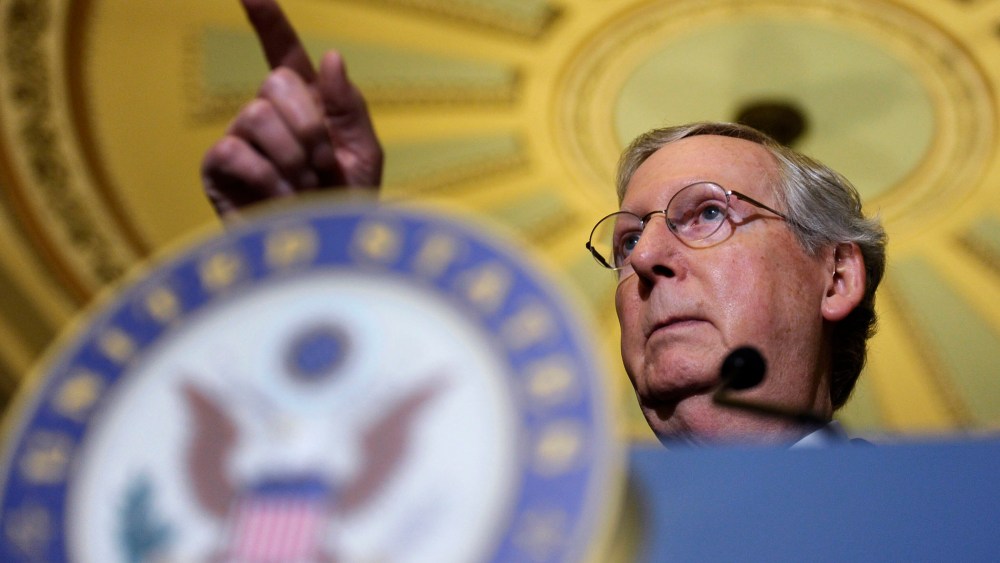 Mitch McConnell speaks to reporters during a news conference on Capitol Hill, Dec. 10, 2013.