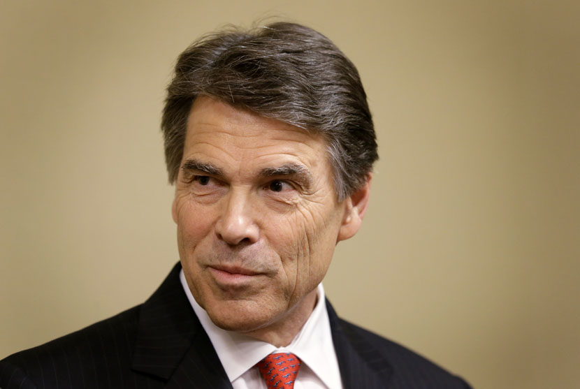 Gov. Rick Perry responds to questions from reporters during a news conference after delivering a speech at the National Right To Life Convention, Thursday, June 27, 2013, in Grapevine, Texas. (Photo by Tony Gutierrez/AP)