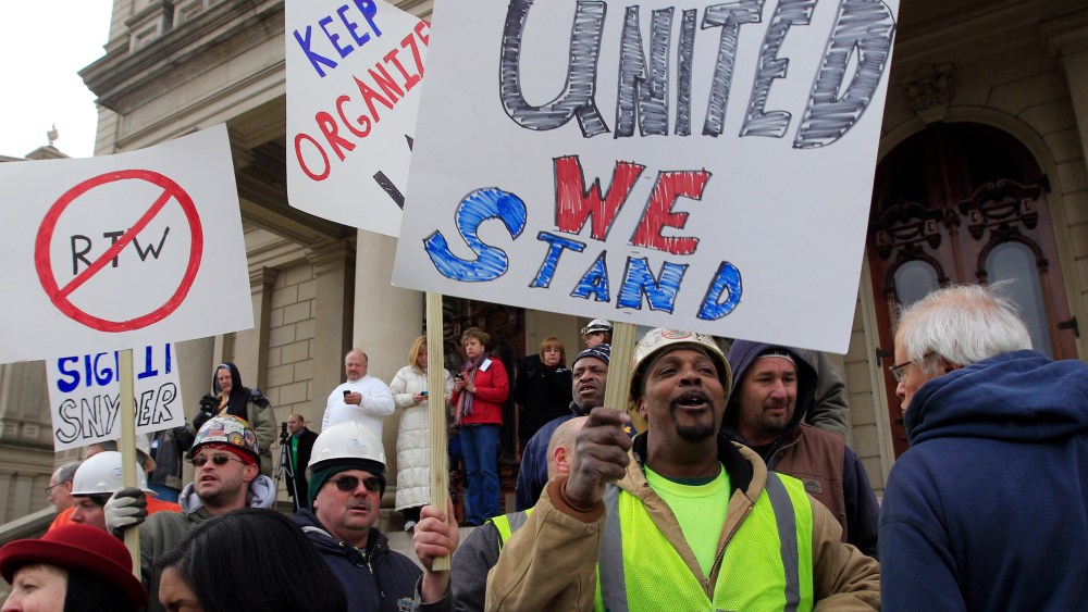 Union workers rally outside the Capitol in Lansing, Mich., Thursday, Dec. 6, 2012 as Senate Republicans introduced right-to-work legislation in the waning days of the legislative session. The outnumbered Democrats pledged to resist the proposal and...