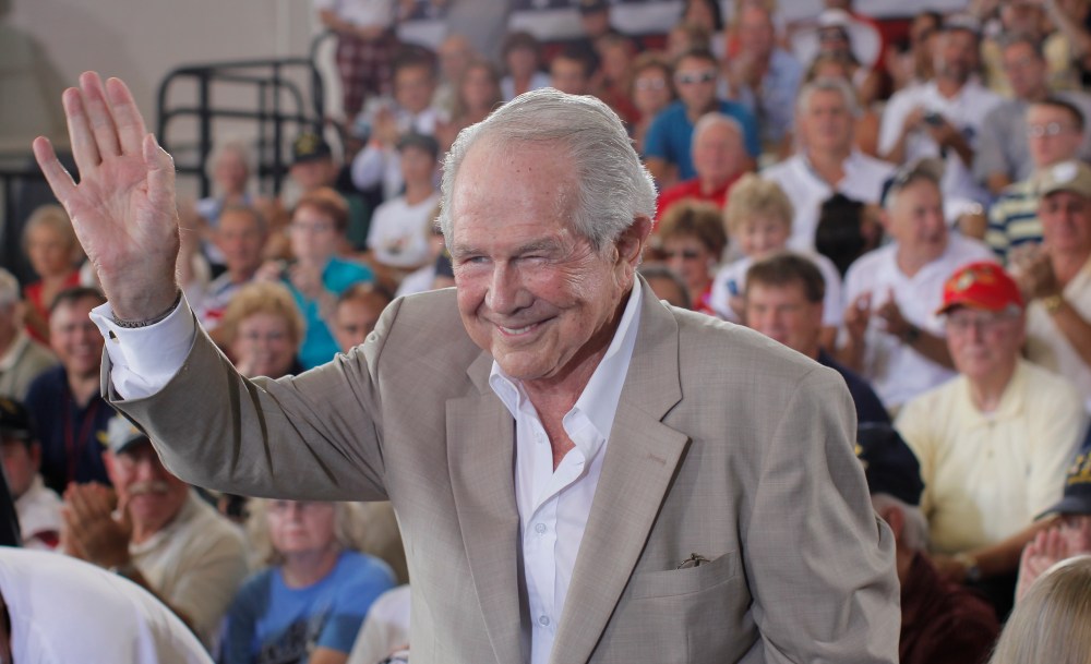 Evangelist Pat Robertson acknowledges the crowd before Republican presidential candidate Mitt Romney campaigns at the Military Aviation Museum in Virginia Beach, Va., Saturday, Sept. 8, 2012. (AP Photo/Charles Dharapak)