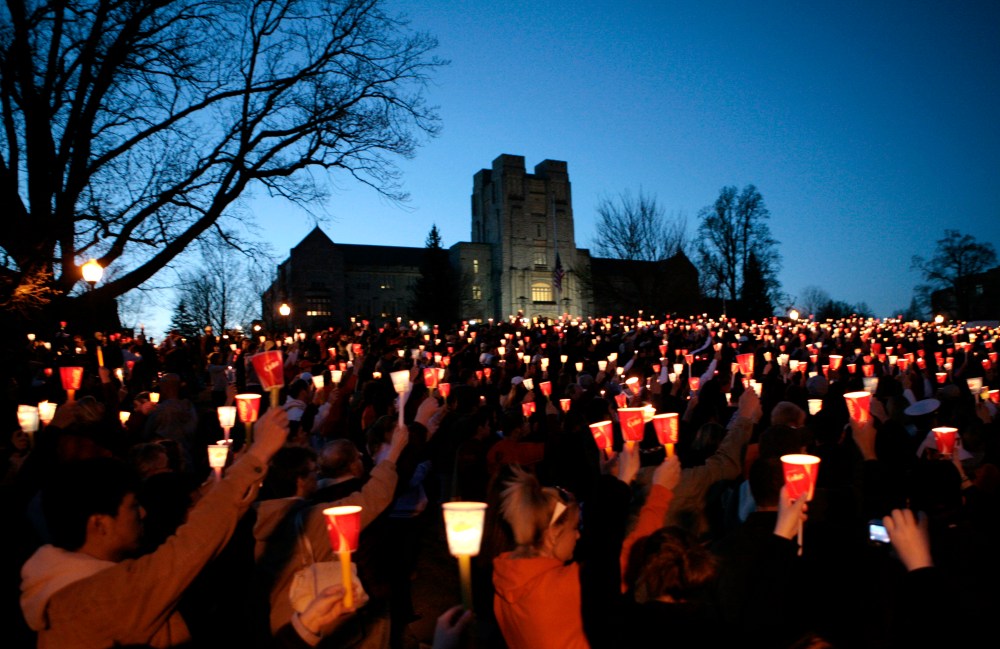 Students take part in a candlelight vigil a day after the killings at Virginia Tech in Blacksburg, Va., April 17, 2007. (Photo by Kevin Lamarque/Reuters)