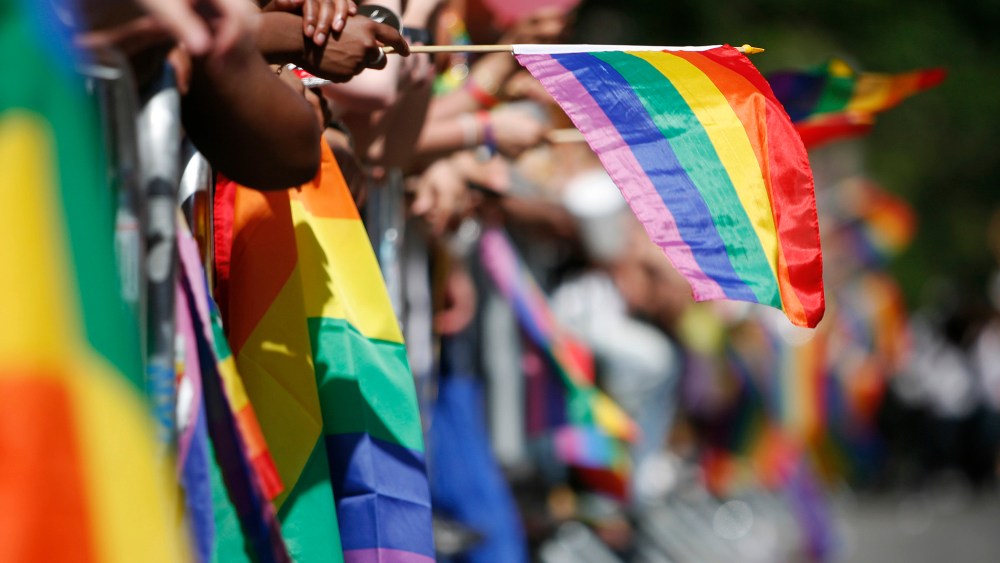 Sidewalks are filled with the rainbow flags as revelers celebrate Gay Pride in New York.