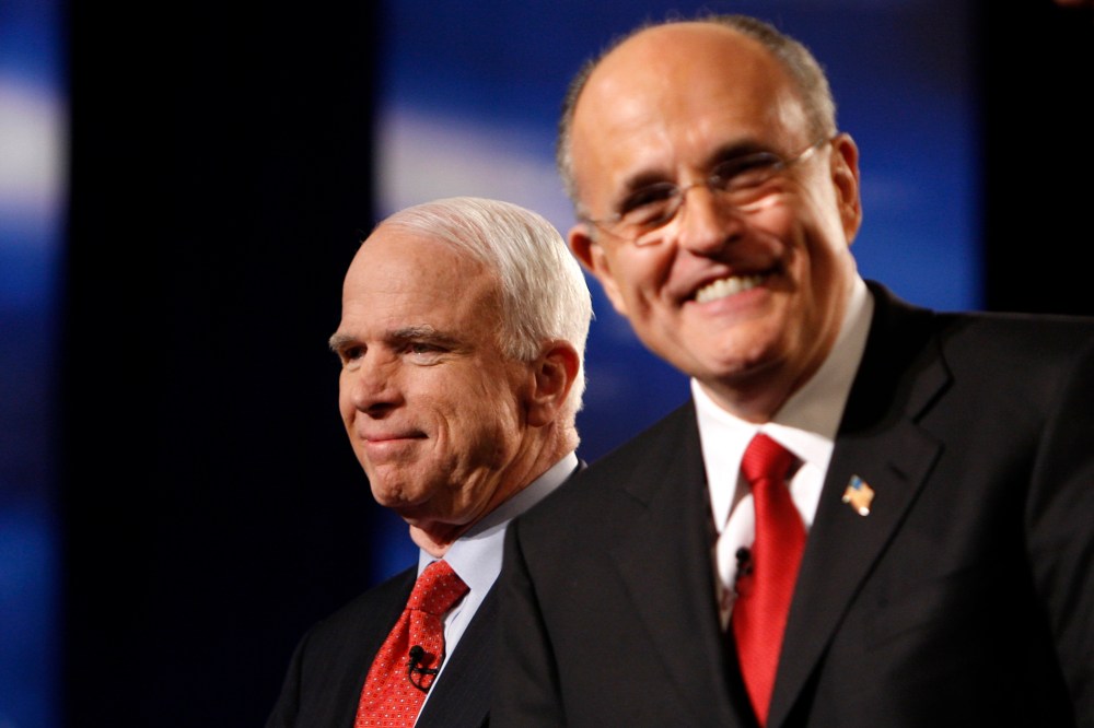 Former US Republican presidential candidates John McCain and Rudy Giuliani smile before the MSNBC Republican presidential debate in Boca Raton, Florida, January 24, 2008. (Photo by Carlos Barria/Reuters)