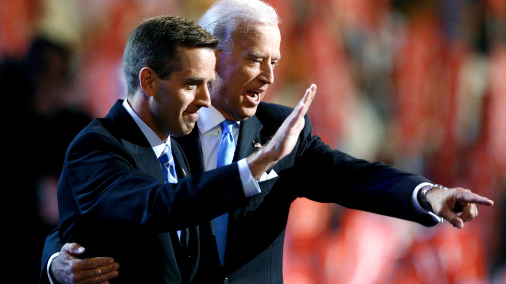 Then-Attorney General Beau Biden (D-DE) (L) and Vice Presidential candidate Senator Joe Biden (D-DE) gesture on stage at the 2008 Democratic National Convention in Denver, Colo., Aug. 27, 2008. (Photo by Chris Wattie/Reuters)