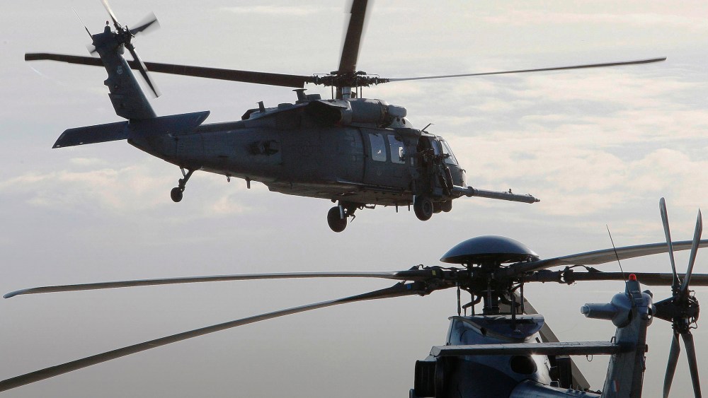 A HH-60 Pave Hawk helicopter of the U.S. 56th RQS (rescue squadron) is seen in flight in Cazaux, southwestern France, Jan. 13, 2010. (Photo by Regis Duvignau/Reuters)