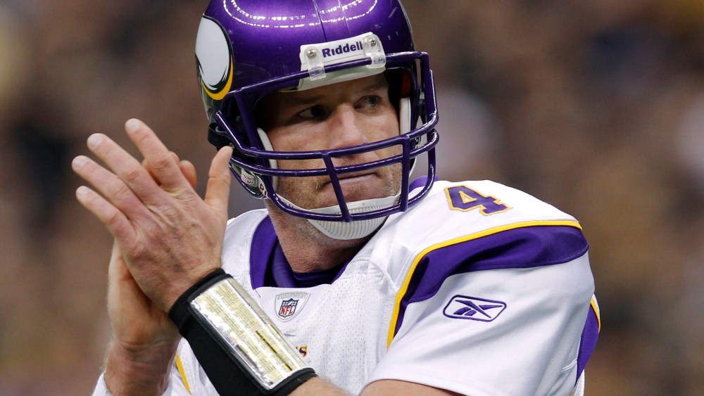 Minnesota Vikings quarterback Brett Favre celebrates his touchdown against the New Orleans Saints during the first quarter of the NFL's NFC Championship football game in New Orleans, Louisiana, Ja. 24, 2010.