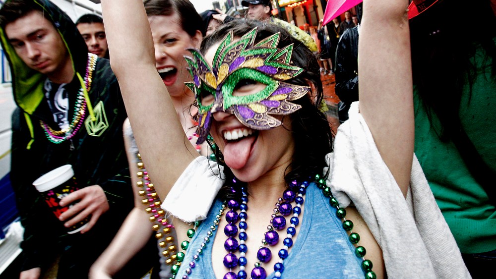 Revelers celebrate Mardi Gras on the streets of the French Quarter in New Orleans on March 5, 2011.