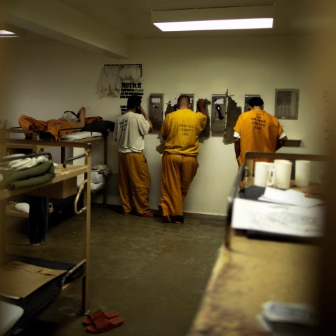 Inmates make phone calls from their cell at the Orange County jail in Santa Ana, California, May 24, 2011.