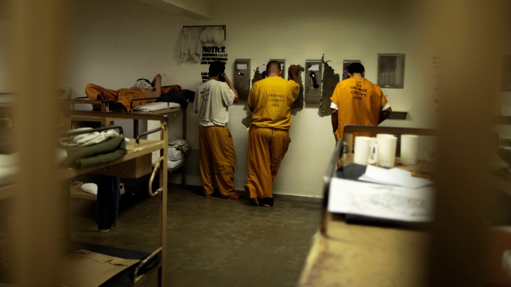 Inmates make phone calls from their cell at the Orange County jail in Santa Ana, California, May 24, 2011.