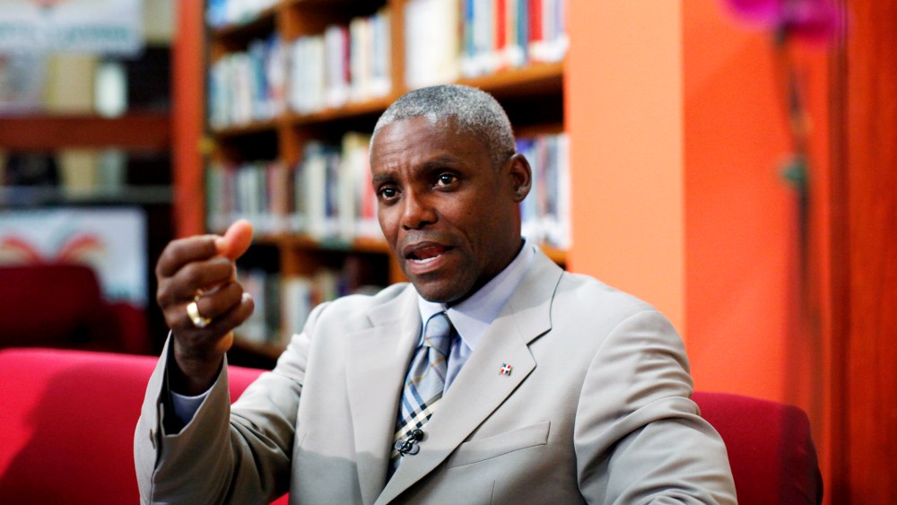 Carl Lewis speaks during a interview with local media in Santo Domingo.