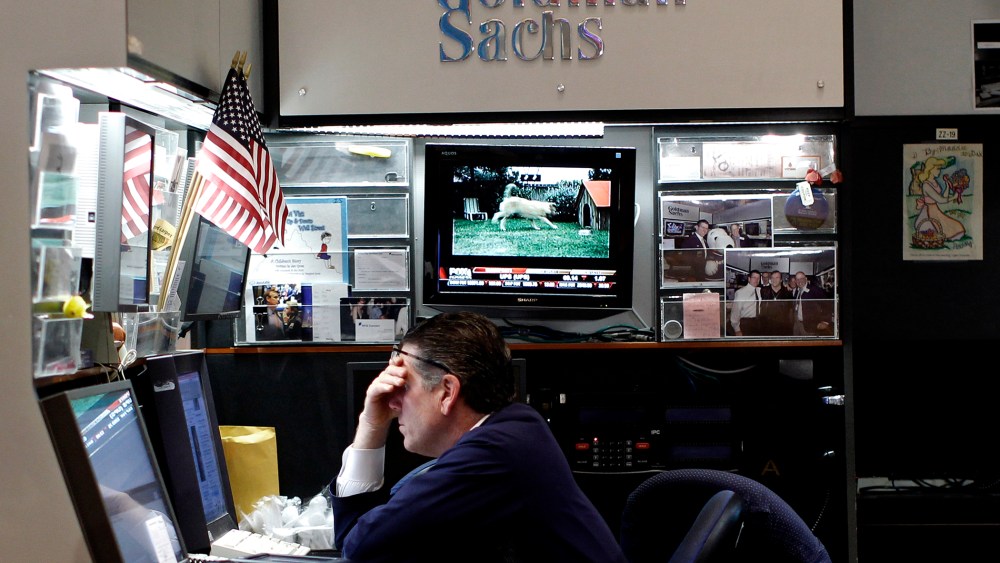 A trader works in the Goldman Sachs booth on the main trading floor of the New York Stock Exchange