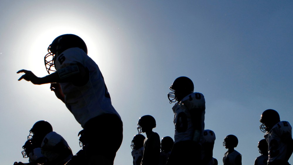 A high school football team practices for their upcoming season in Arizona.