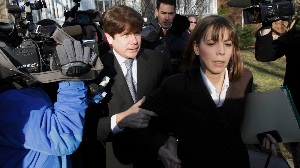 Disgraced former Illinois Gov. Rod Blagojevich and his wife Patti leave their Chicago home for the second day of his sentencing hearing, Dec. 7, 2011. (Photo by John Gress/Reuters)