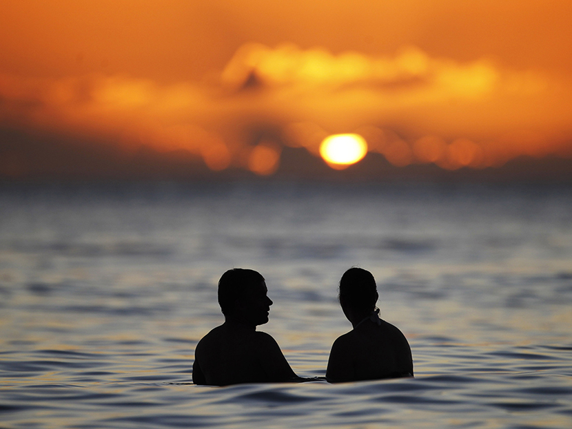 Sunset from the waters off Waikiki Beach in Honolulu, Hawaii. (File photo by Jason Reed/Reuters)