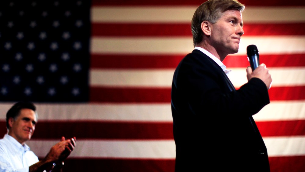 Mitt Romney applauds his endorsement from Virginia Governor Bob McDonnell during a campaign rally in North Charleston, South Carolina, Jan. 20, 2012.