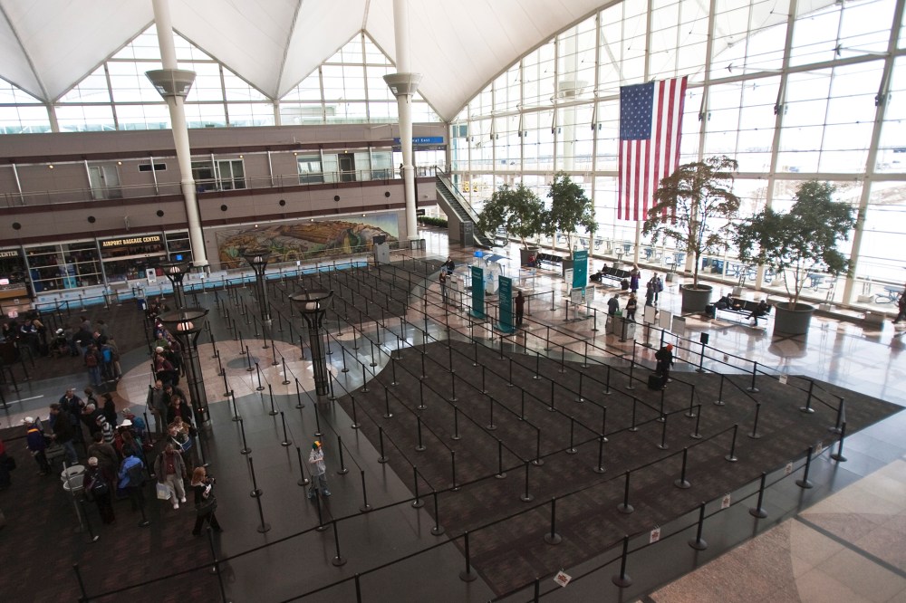 Passengers wait in security lines at the Denver International Airport in Denver, Colo. (Photo by Nathan Armes/Reuters)
