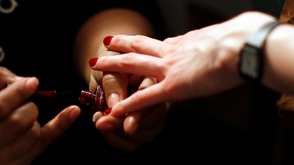 Models prepare backstage for the Bill Blass Fall/Winter 2012 collection show during New York Fashion Week