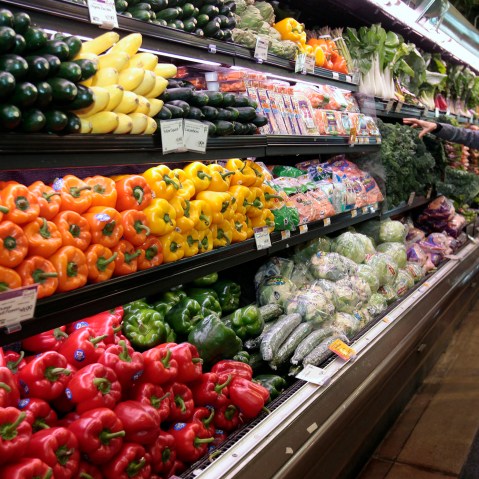 A customer shops for fresh produce at the Whole Foods grocery story in Ann Arbor, Mich., March 8, 2012. (Photo by Rebecca Cook/Reuters)