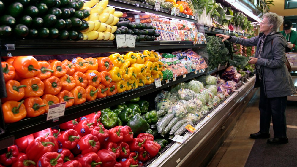 A customer shops for fresh produce at the Whole Foods grocery story in Ann Arbor, Mich., March 8, 2012. (Photo by Rebecca Cook/Reuters)