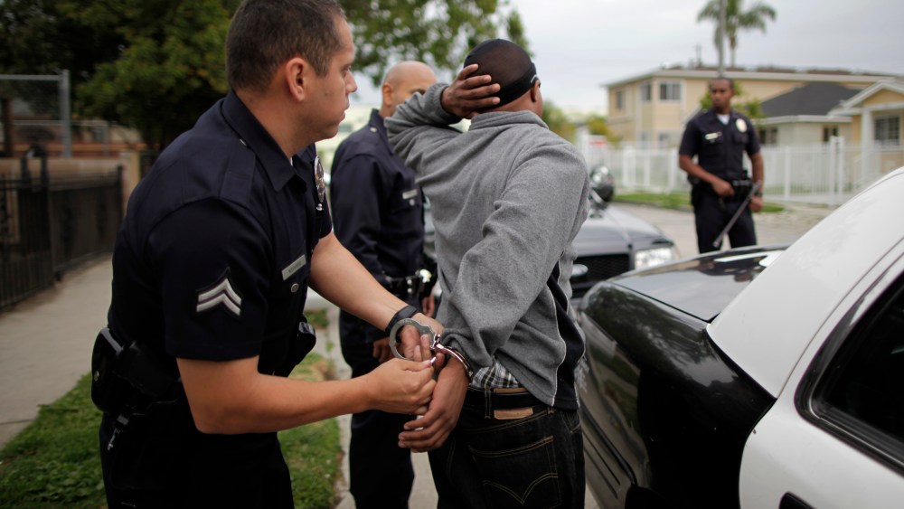 A man is handcuffed in south Los Angeles, California, April 25, 2012.