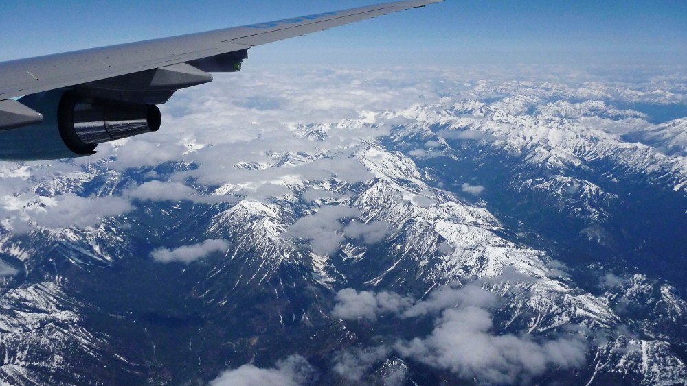 A plane flies over the Cascade Range as it heads towards Seattle.