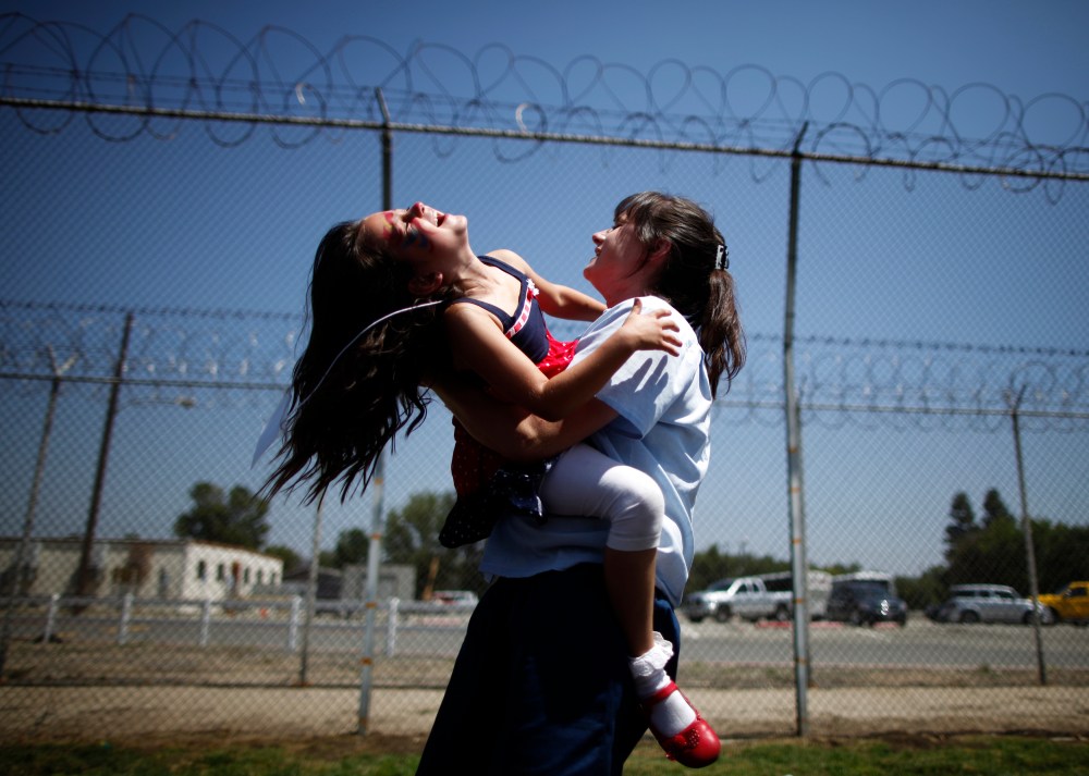 Cori Walters hugs her daughter Hannah at California Institute for Women state prison in Chino, California May 5, 2012.