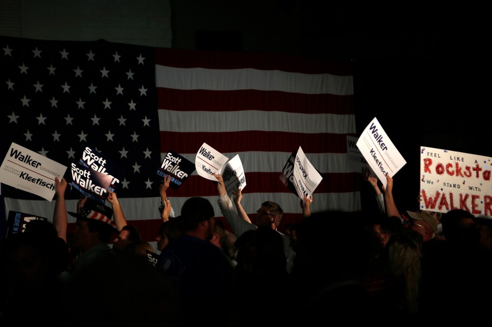 Supporters cheer during an election night rally for Republican Wisconsin Governor Walker in Waukesha