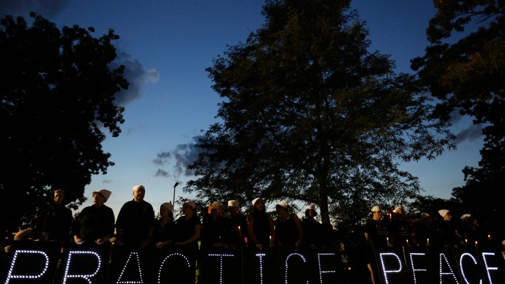 The community gathers for a vigil in Oak Creek - Traci Lee - 09/23/2013