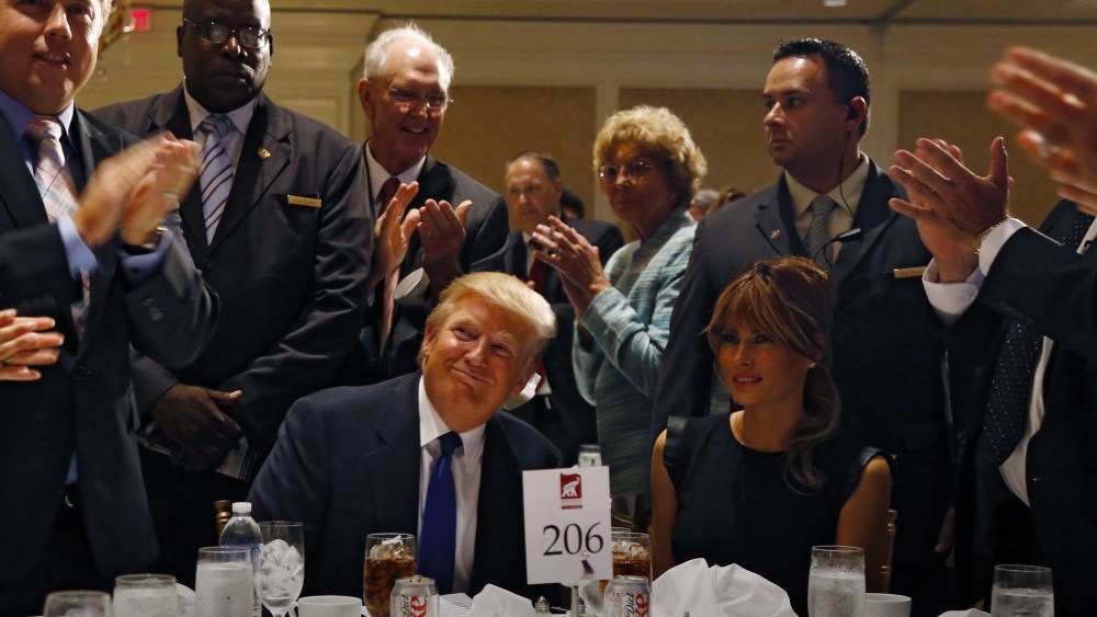 Donald Trump and his wife Melania are applauded before a dinner hosted by the Sarasota Republican Party honoring him as Statesman of the Year in Sarasota, Fla., August 26, 2012. (Photo by Mike Carlson/Reuters)