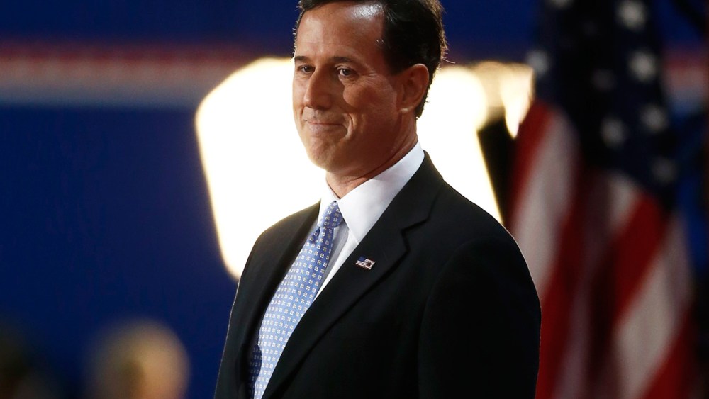 Former U.S. Republican presidential candidate Rick Santorum arrives to address delegates during the second day of the Republican National Convention in Tampa.