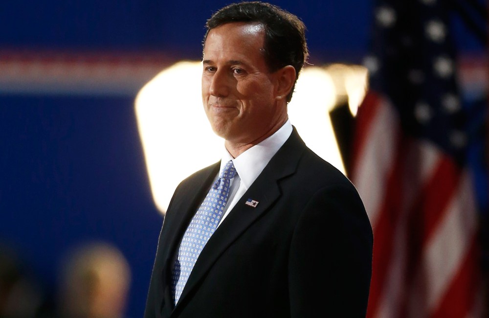 Former U.S. Republican presidential candidate Rick Santorum arrives to address delegates during the second day of the Republican National Convention in Tampa.