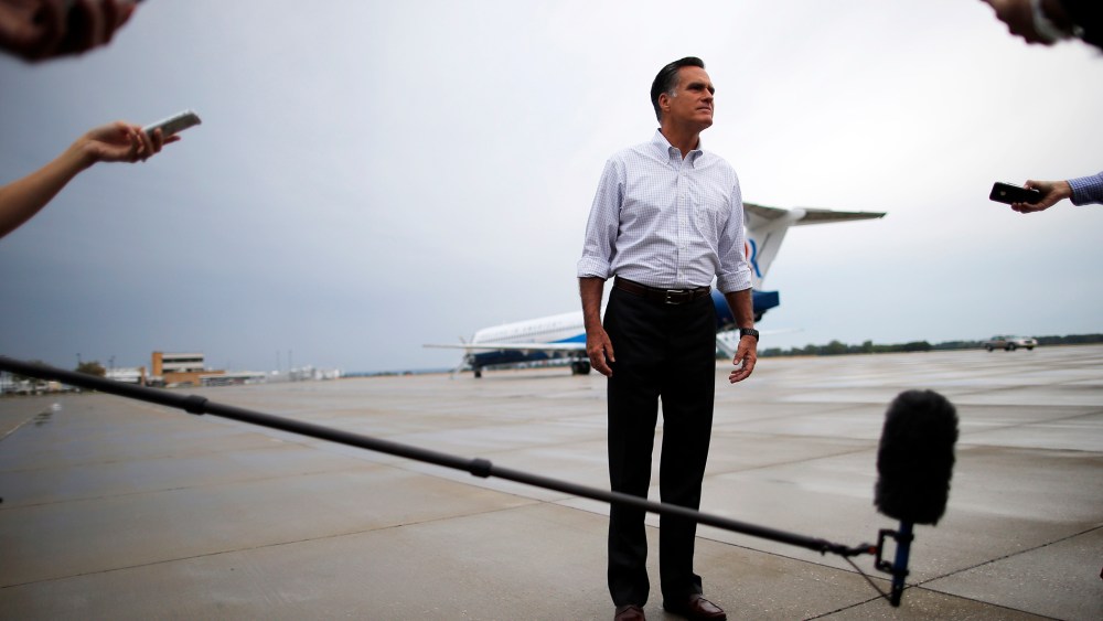 Then, Republican presidential candidate and former Massachusetts Governor Mitt Romney listens to a question from a reporter at the airport in Sergeant Bluff, Iowa on Sept. 7, 2012. (Photo by Brian Snyder/Reuters)