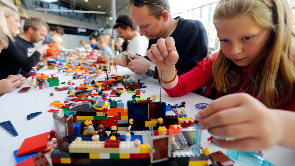 Haga, her father Trond and her brother Henrik attend the annual Lego Festival, where the theme is building your dream city, at the Technical Museum in Oslo