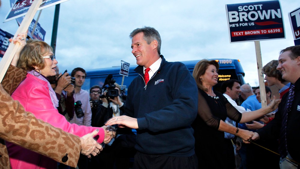 Senator Scott Brown shakes hands with supporters in Wakefield, Massachusetts Nov. 1, 2012.