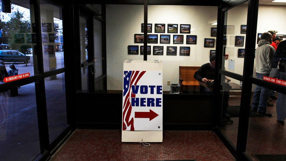 Signs direct voters to the Licking County Board of Elections to open in Newark, Ohio, Nov. 3, 2012.