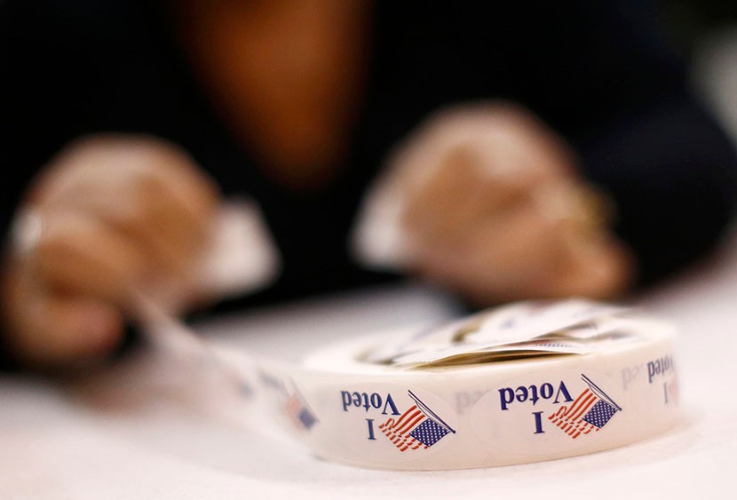 A poll worker prepares 'I Voted' stickers at Harrison United Methodist Church during the U.S. presidential election in Pineville, North Carolina November 6, 2012. (Photo by Chris Keane/Reuters)