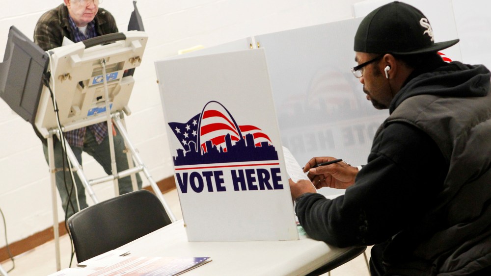 People vote at Missouri School for the Blind during the U.S. Presidential Election in St. Louis, Missouri, November 6, 2012.