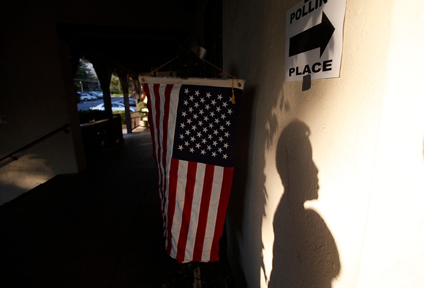 A voter's shadow is seen on the wall during the U.S. presidential election at the Altadena Town & Country Club in Altadena, California November 6, 2012.  (Photo by Mario Anzuoni/Reuters)