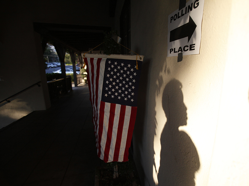 A voter's shadow is seen on the wall during the U.S. presidential election at the Altadena Town & Country Club in Altadena, California November 6, 2012.  (Photo by Mario Anzuoni/Reuters)