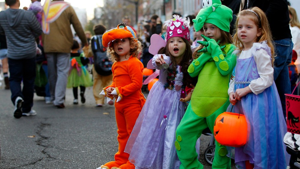 Children participate in the postponed annual Ragamuffin Halloween Parade in Hoboken