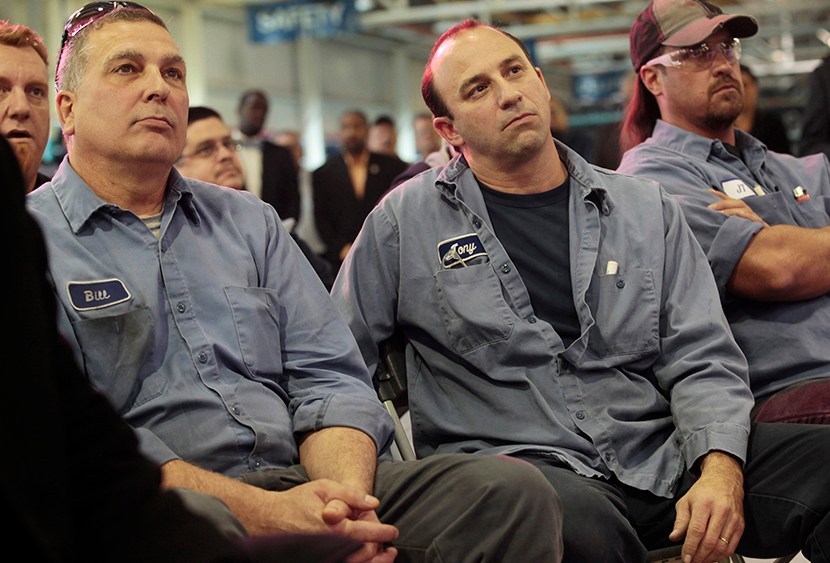 Chrysler Mack I Engine Plant assembly workers Bill Galecki (L), Tony Russo and John Terry (R) listen during a news conference to announce a major financial investment and more jobs added to the engine plant in Detroit, Michigan November 15, 2012. ...