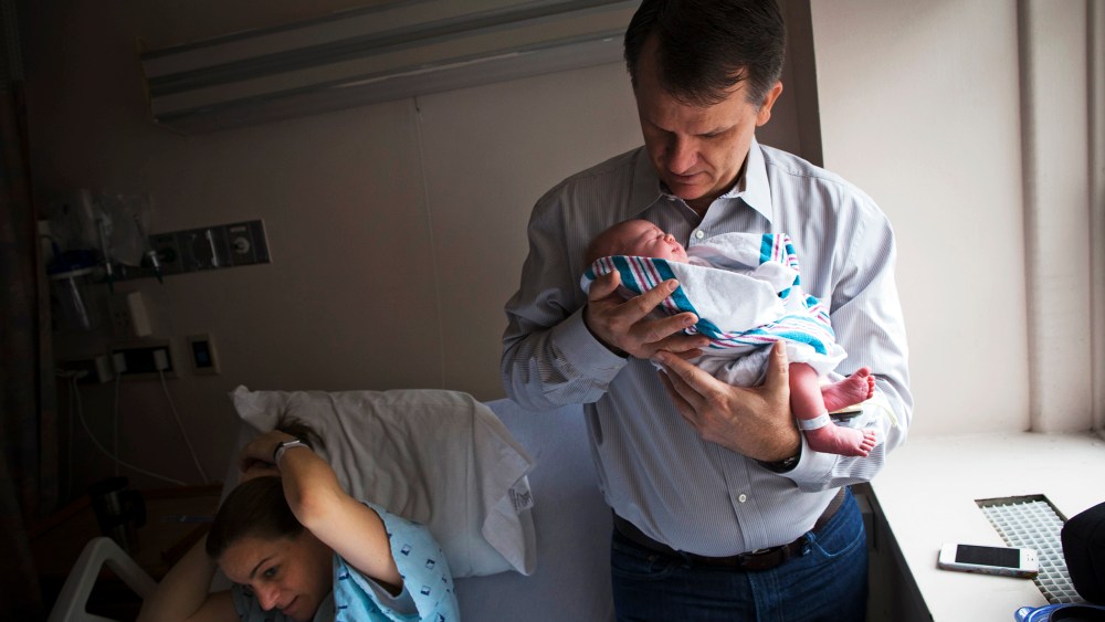 Dale Smith holds his newborn baby at the New York Downtown Hospital, Dec.12, 2012.