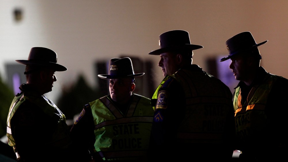 A Connecticut State Police Officers stand outside the Sandy Hook Volunteer Fire and Rescue Company near Sandy Hook Elementary School in Newtown, Connecticut Dec. 14, 2012.