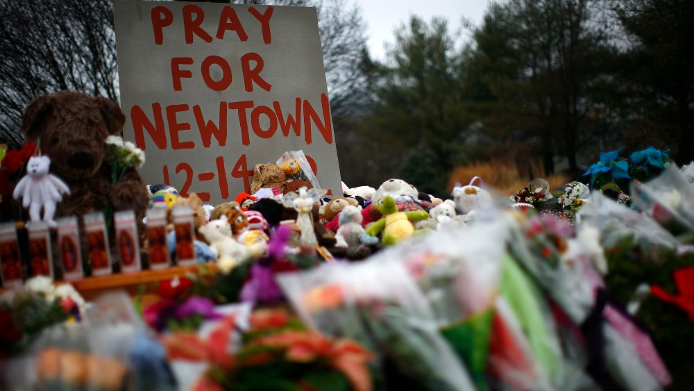 Flowers, candles and stuffed animals are seen at a makeshift memorial in Newtown, Connecticut on Dec. 17, 2012.