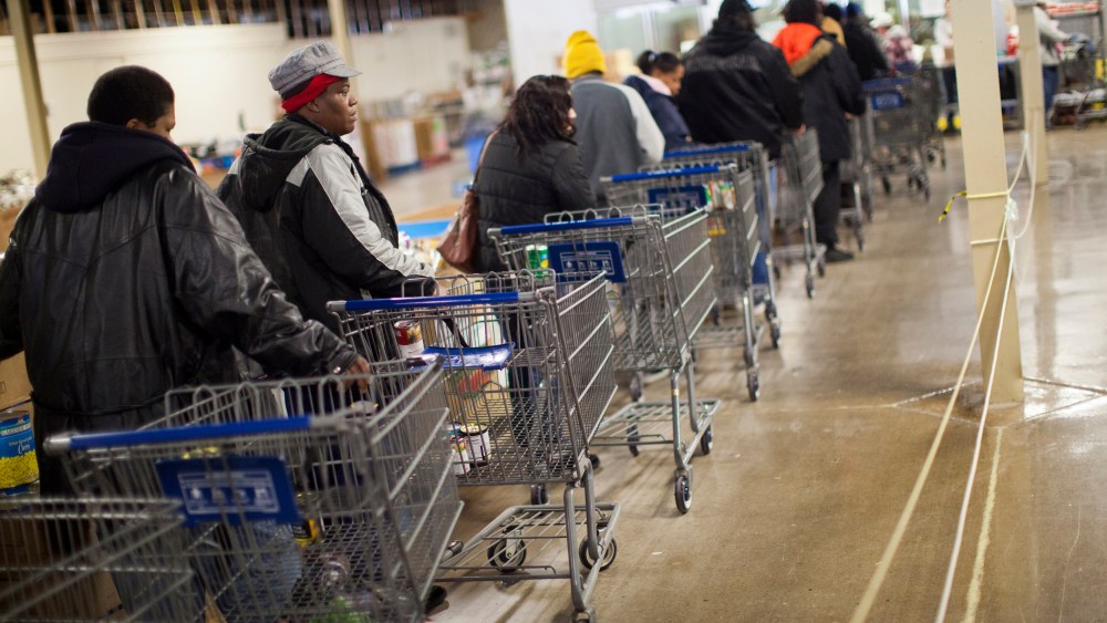 Clients wait in line to shop for food at St. Vincent de Paul food pantry in Indianapolis